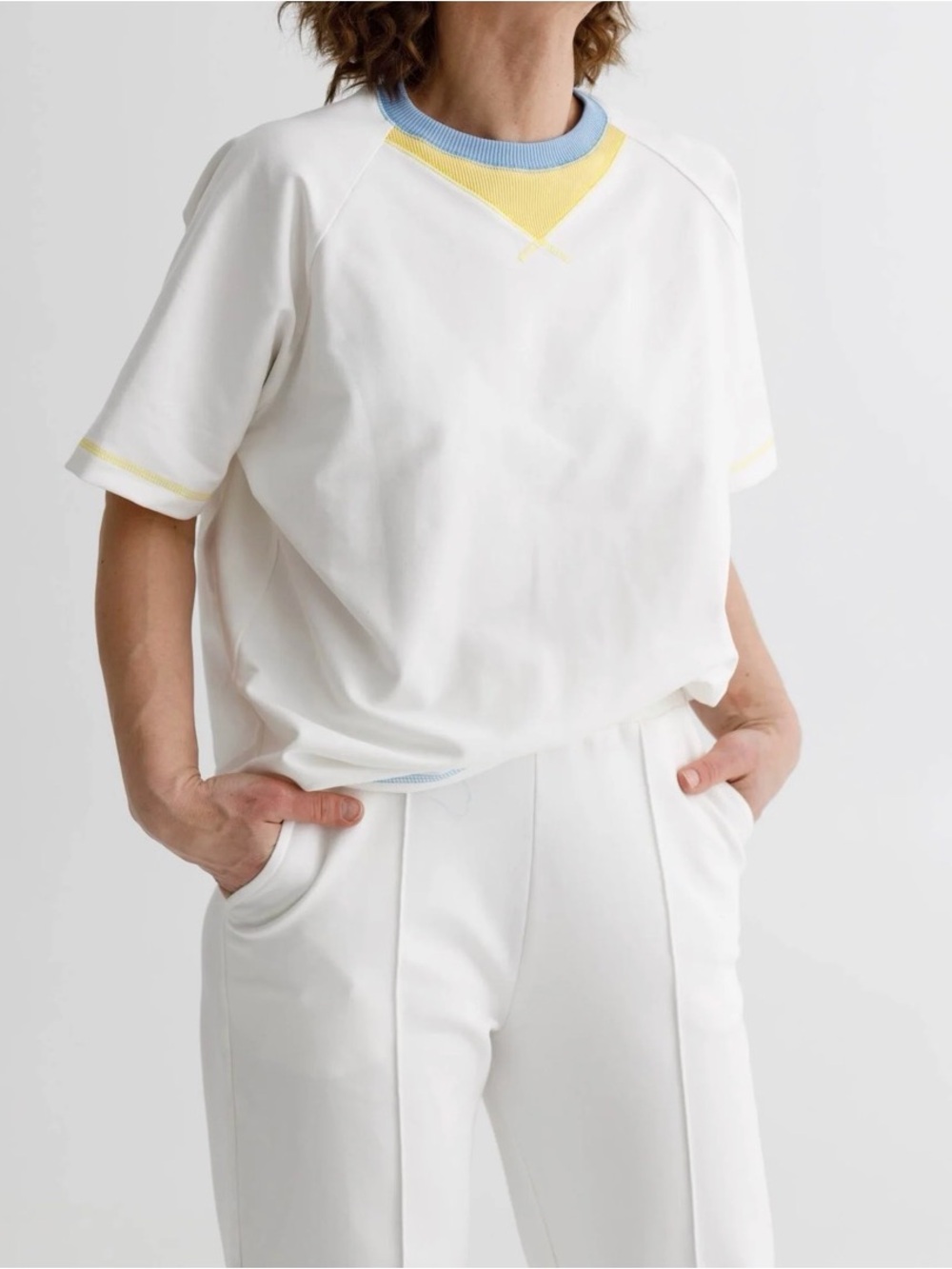 Cream Tee with Light Blue Rib Neckline and Yellow Stitching